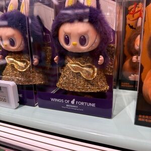 Wings of Fortune Purple and Gold Action Figure